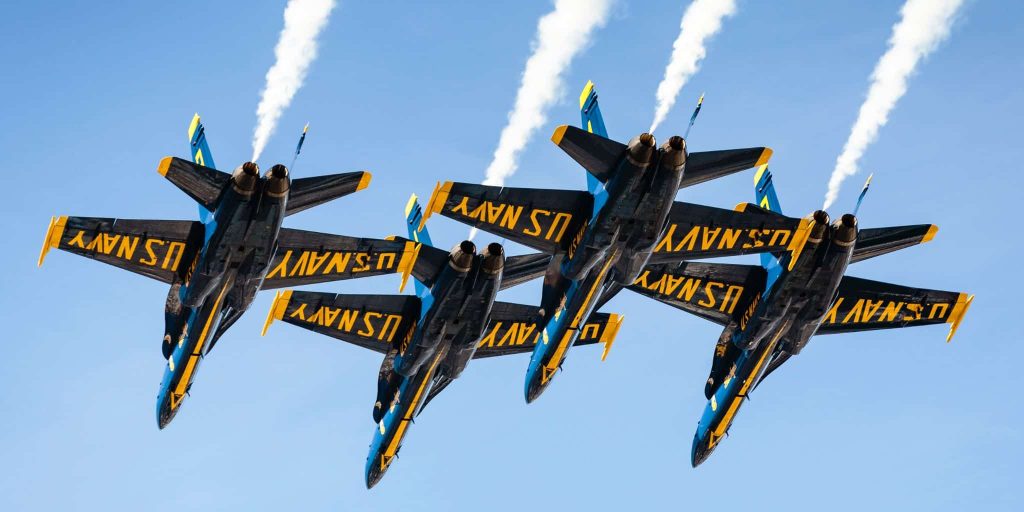 four US navy planes flying in formation