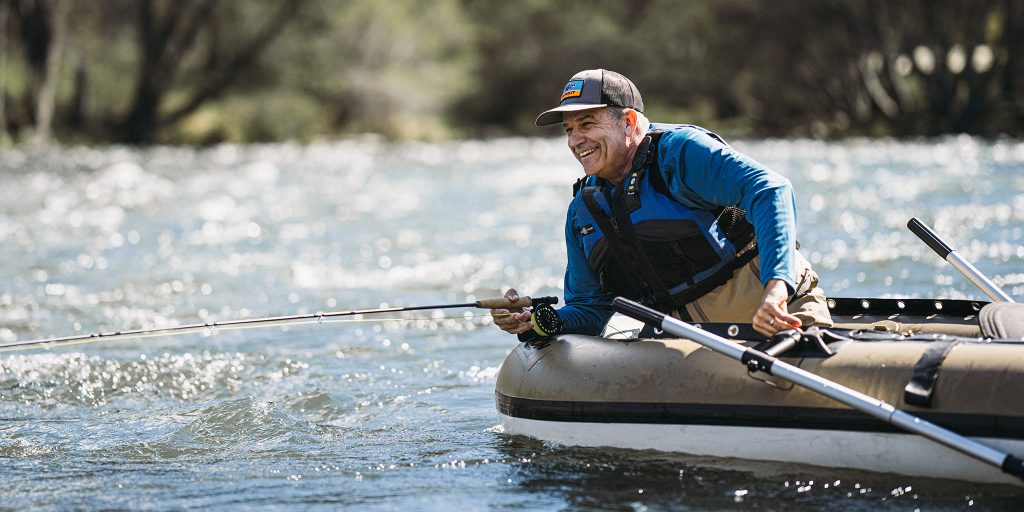retired veteran fishing in a boat on a lake