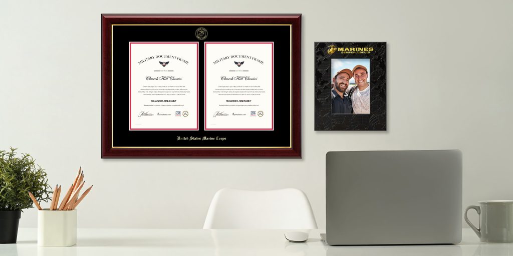 custom US marines double certificate frame and custom photo frame hanging on wall behind a desk